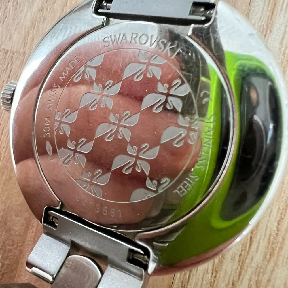 Swarovski ladies stainless steel charcoal gray dial dress watch NEW BATTERY